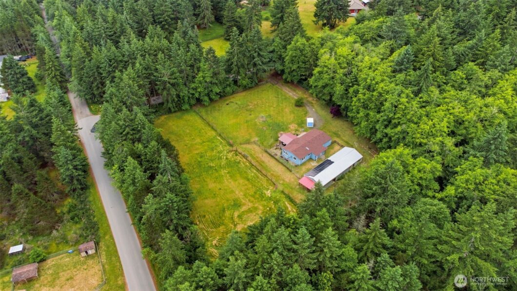 The user wants a short, descriptive sentence for the image's alt text.
1. **Identify the main subject:** An aerial view o...